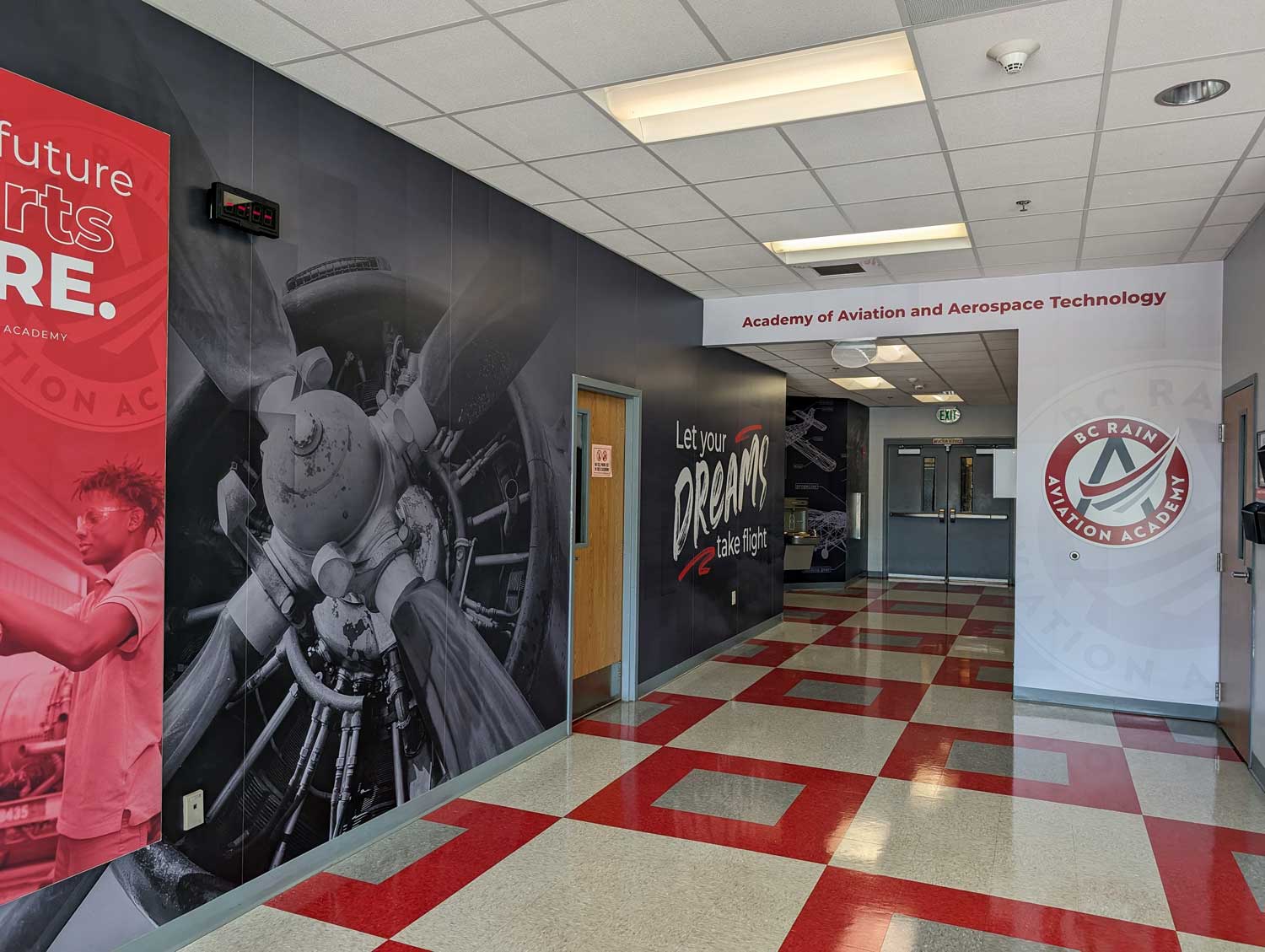 BC Rain High School Aviation Academy hallway with wall graphics and aviation-themed branding