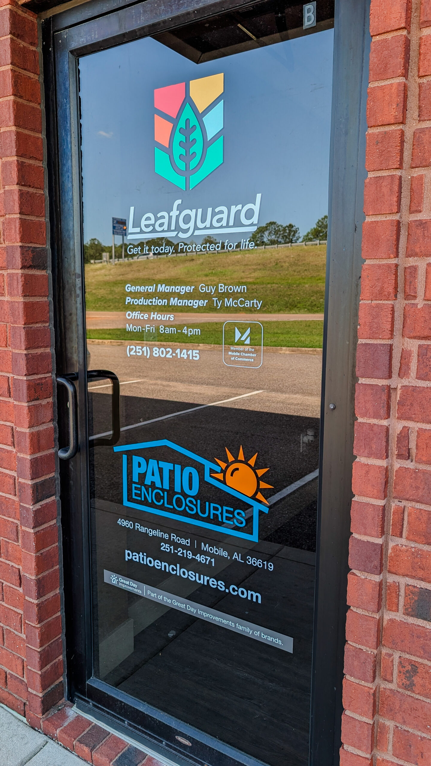 Vinyl window graphics installed on Leafguard office door in Mobile Alabama