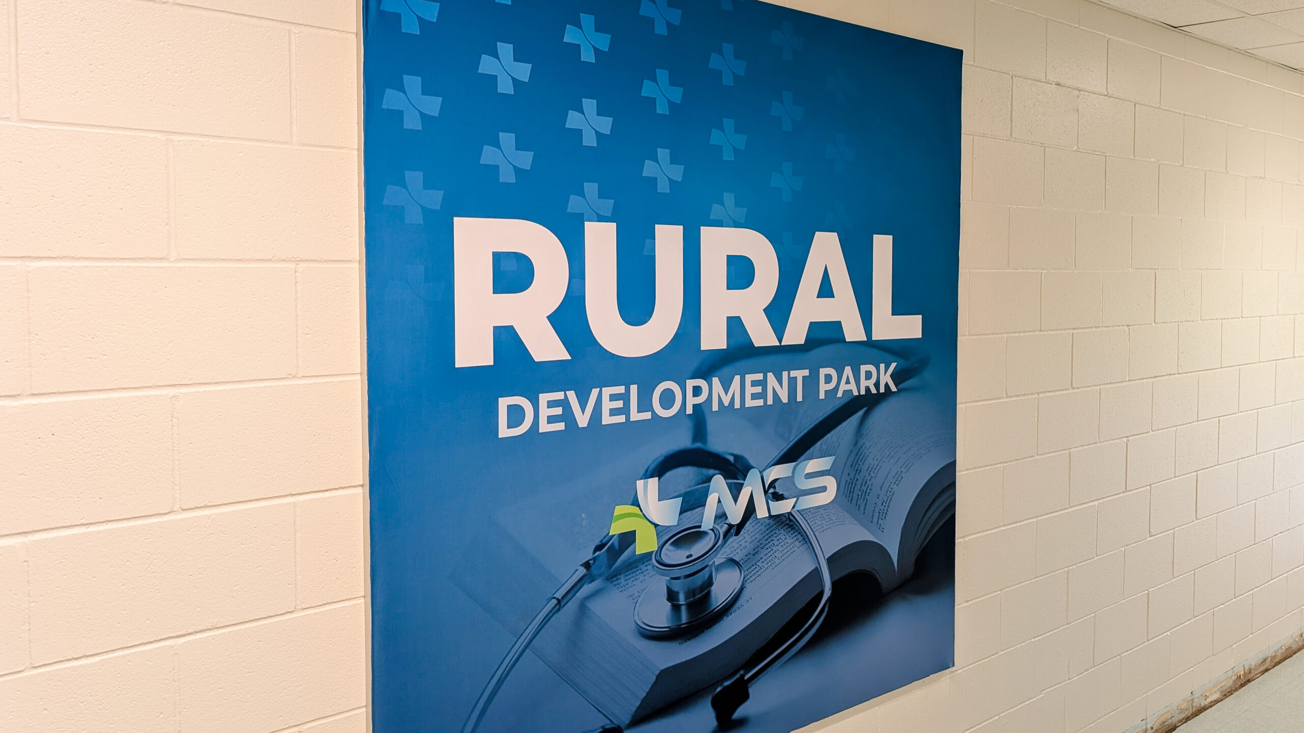 Large format wall graphics installed at Morgan County Tech Park promoting MCS Rural Development Park programs.