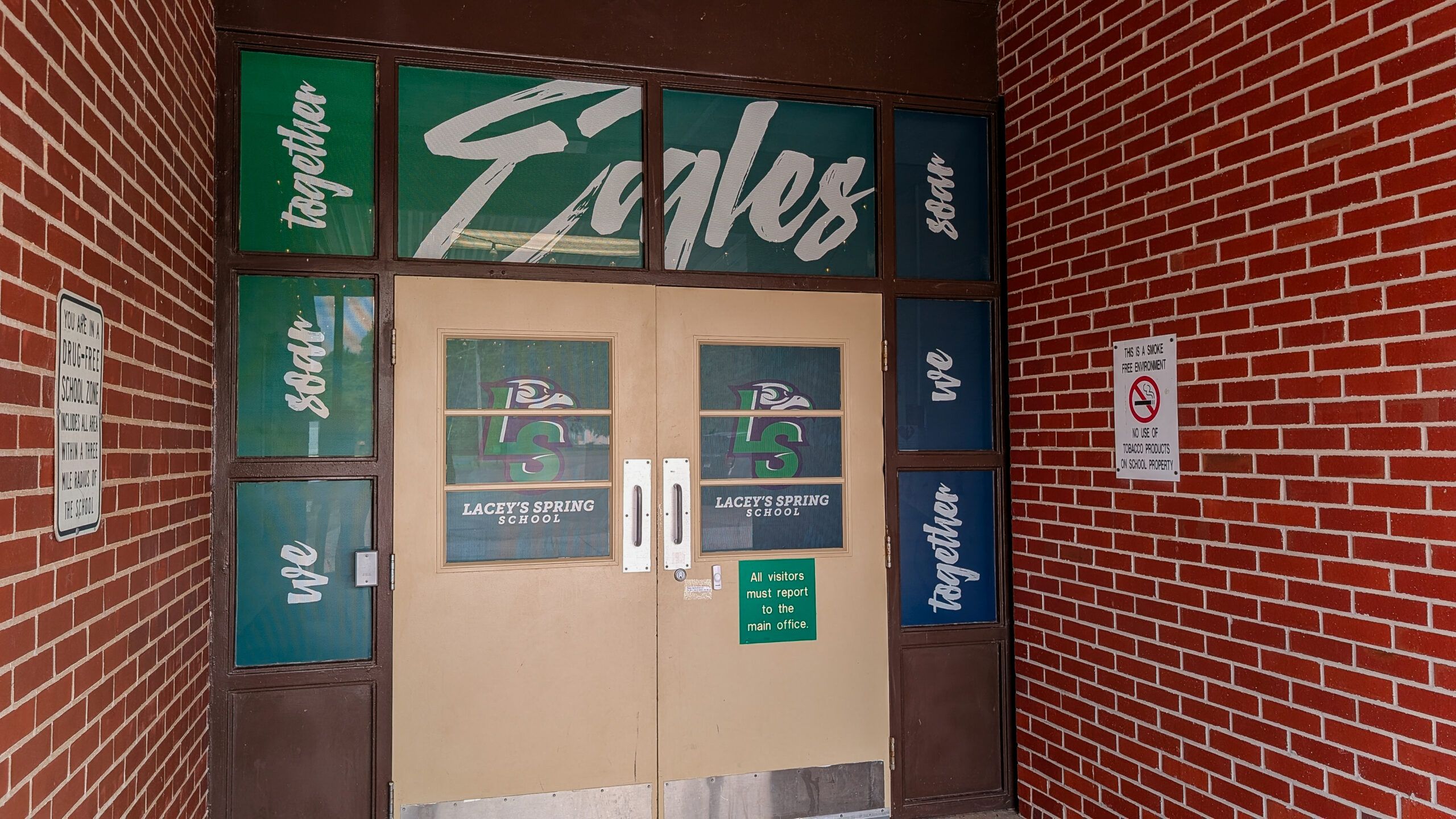 chool entrance windows wrapped with branded graphics at Lacey Springs School in Alabama.