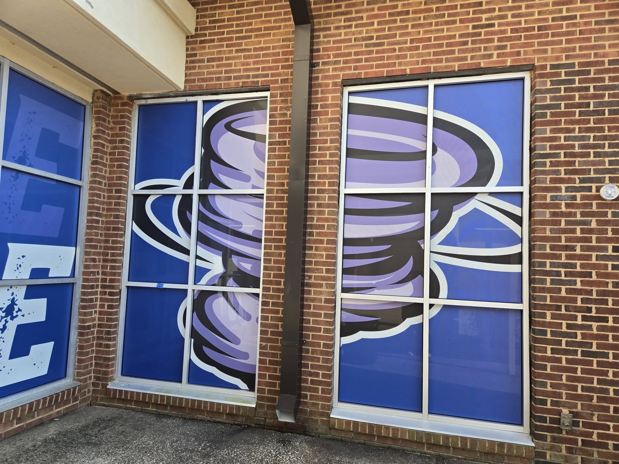 school entrance doors with perforated vinyl window graphics for privacy and branding