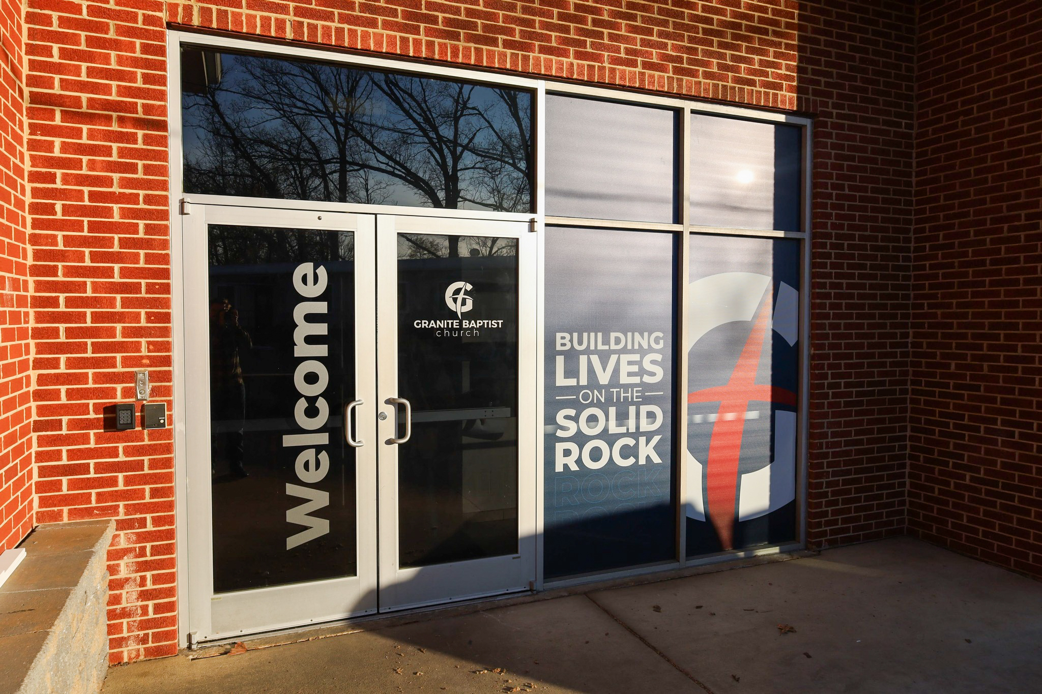 Church branding with window perf and door vinyl graphics