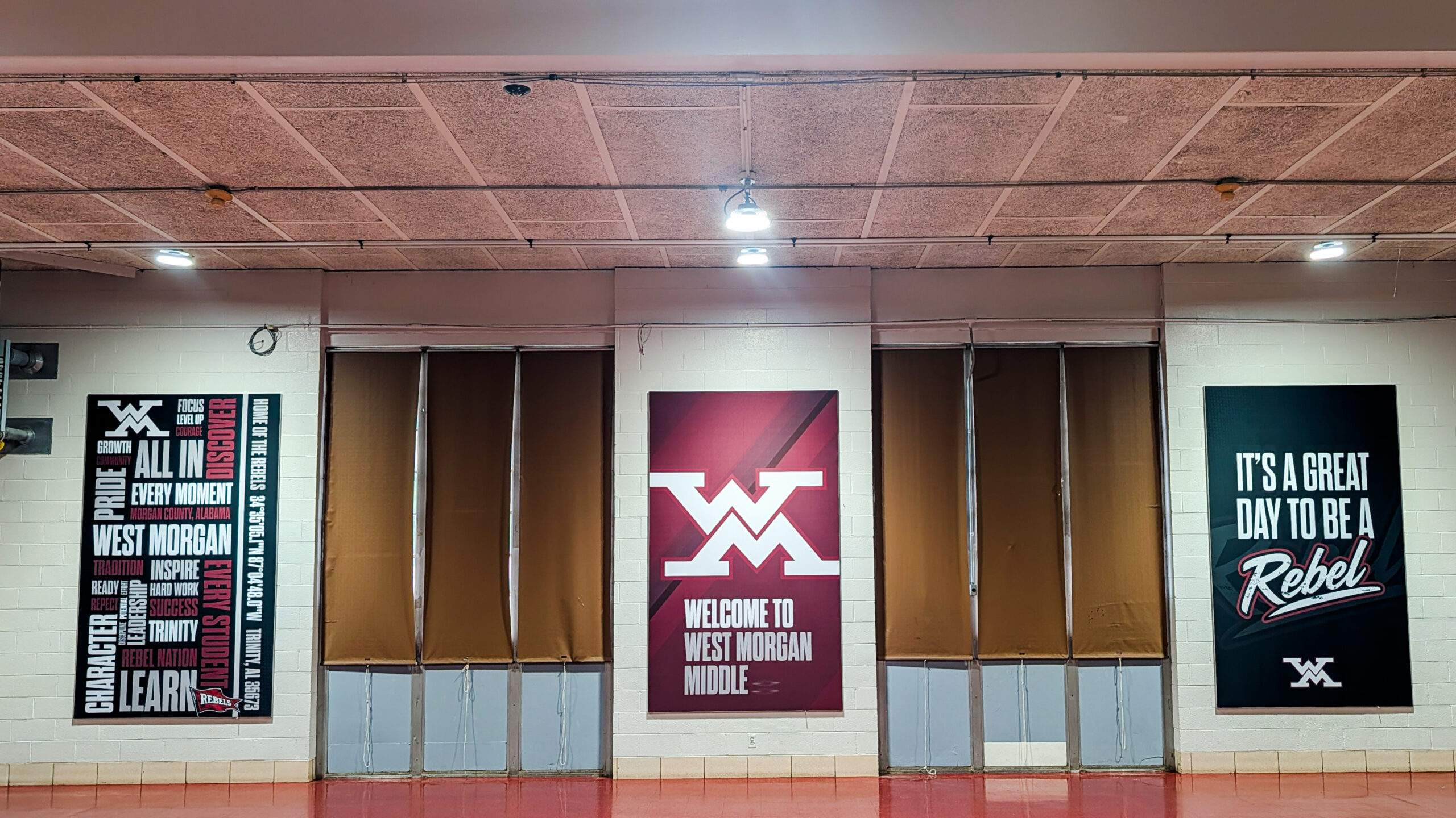 West Morgan Middle School SEG Fabric Displays Large SEG fabric graphics displayed in the West Morgan Middle School cafeteria featuring school pride and welcome messaging.